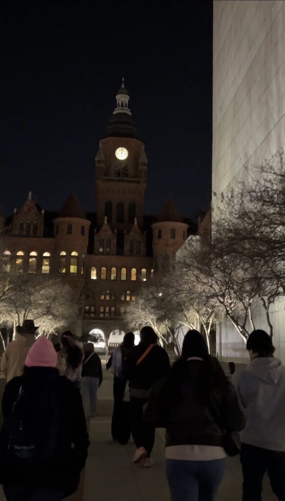 Group of people walking through historic streets on the Dallas ghost tour with US Ghost Tour Adventures
